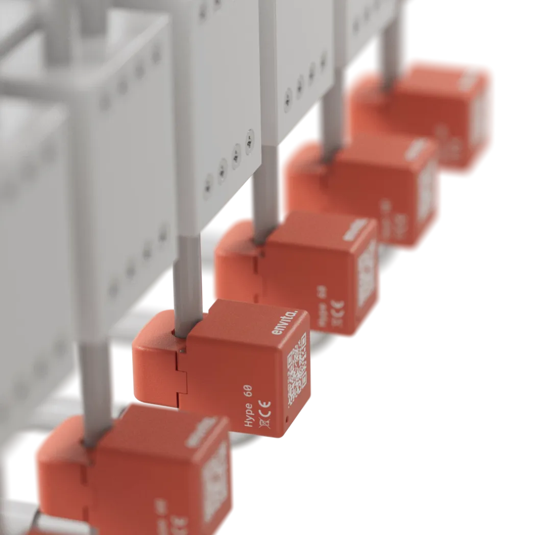 Envita Hype sensors clipped around cables below a row of breakers.